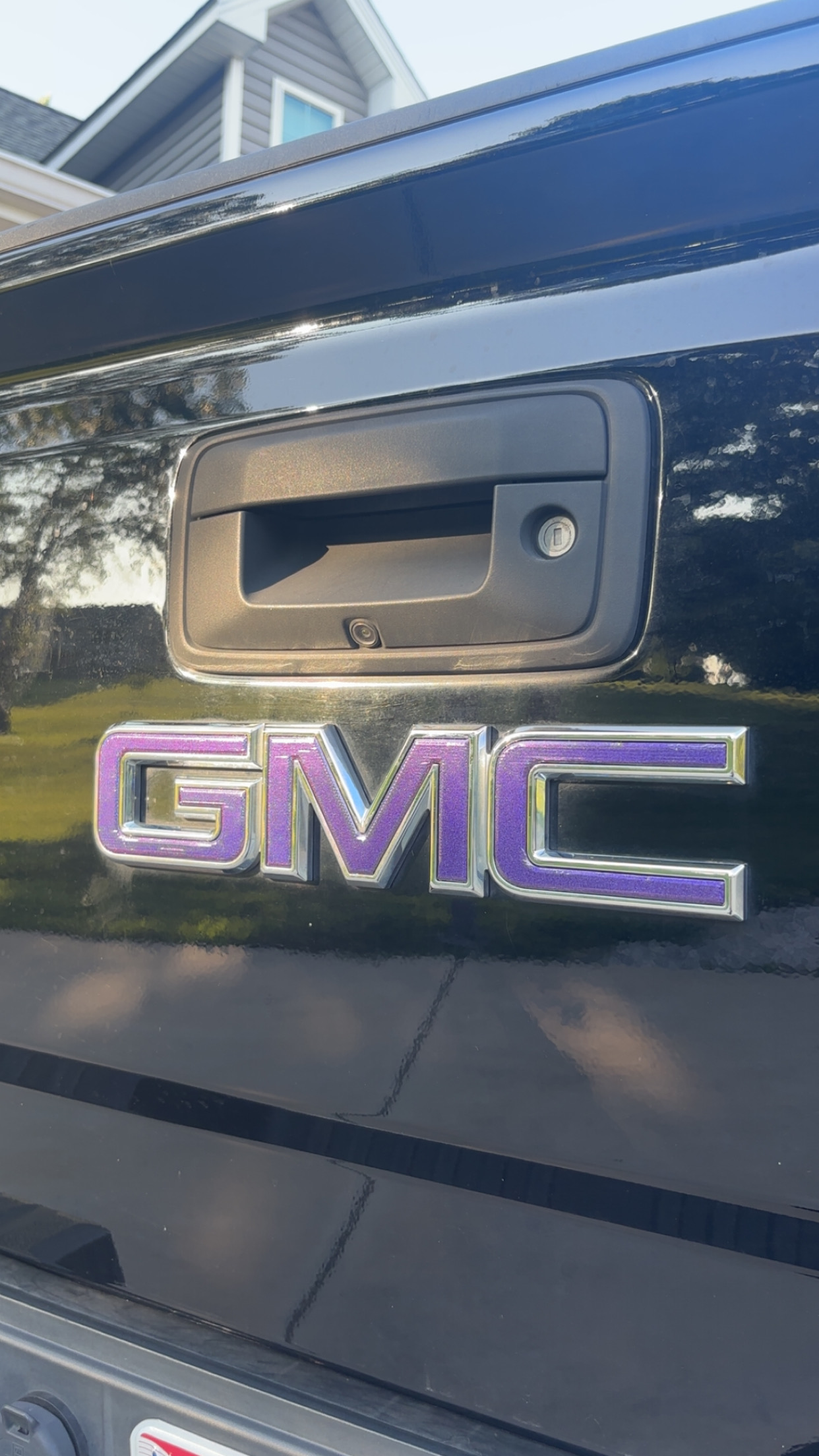 GMC purple chrome emblem wrap after