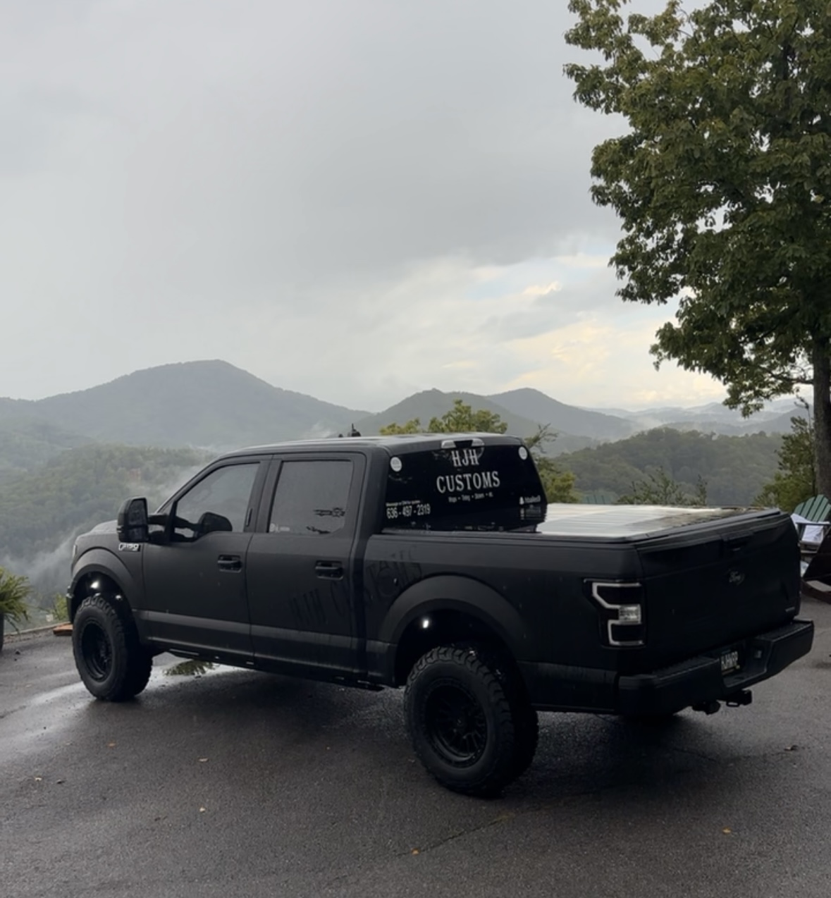 Matte black Ford F150 with HJH Customs rear window decal